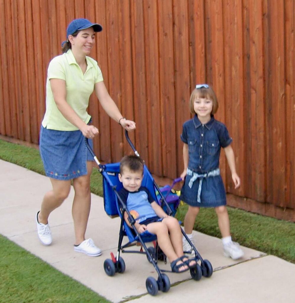 Kelley Thomas and children walk to their school in Richardson.